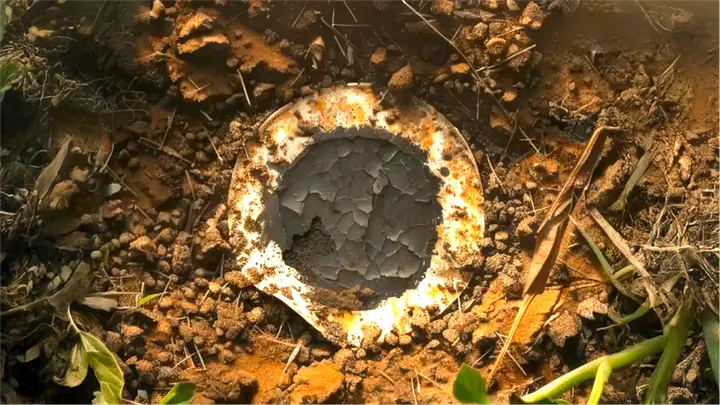 A Flint Paper Battery composting in the dirt